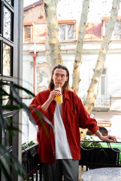 A solo traveler enjoys a vibrant street art scene in Portland, Oregon, with food trucks in the background, embodying urban exploration and culinary adventure.