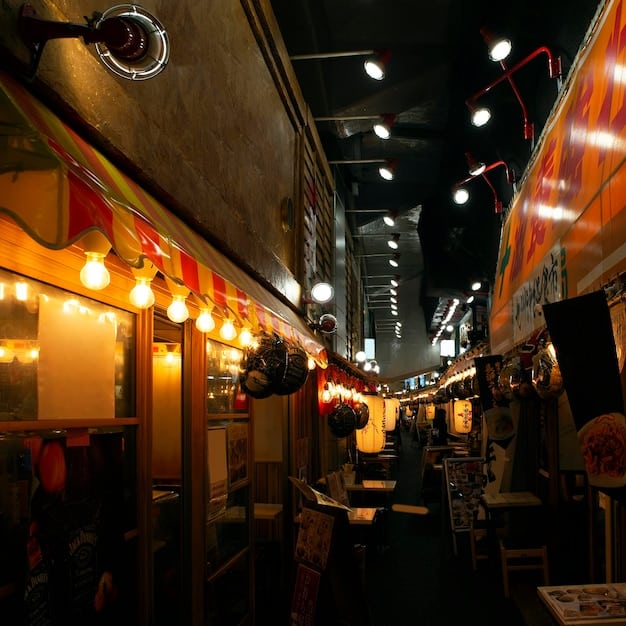 A bustling street food market scene at dusk, with diverse food stalls illuminated by strings of lights, people conversing and enjoying various ethnic dishes, representing a lively and communal food experience.