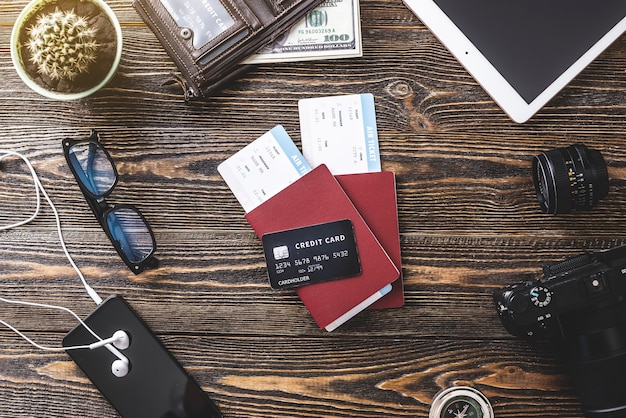 Several credit cards displaying various brands and reward categories, fanned out on a table next to a passport.