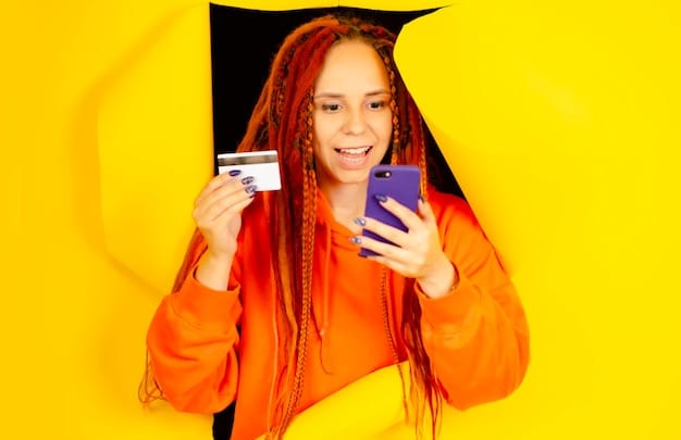 A person excitedly unboxing a new electronic gadget, with a credit card clearly visible on a nearby table. The background shows part of their living room, suggesting a comfortable, home-based acquisition.
