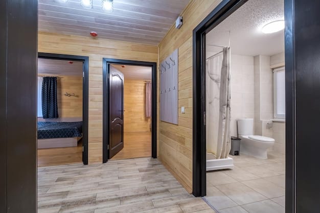 A modern, accessible hotel room featuring wide doorways, a roll-in shower, and grab bars in the bathroom. The image exemplifies the accessible lodging options available for travelers with disabilities, as highlighted in The Complete Guide to Accessible Travel in the US: Updated for 2025.