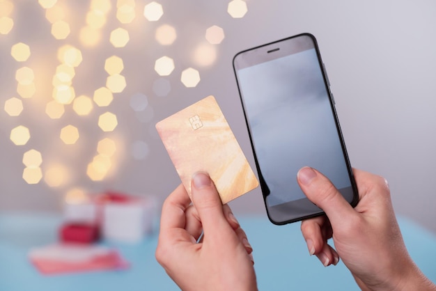 A close-up of a hand holding a smartphone displaying a credit card rewards app, with various options for redeeming points like travel bookings, gift cards, and cash back. The app interface should be clean and user-friendly, illustrating the ease of managing and using rewards earned from Credit Card Sign-Up Bonuses: Earn 100,000 Points or More with These Limited-Time Offers.