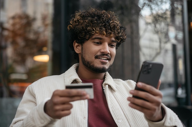 A person using a mobile app on their phone to track their credit card spending. The app shows categorized expenses such as dining, travel, and groceries, with corresponding rewards earned. The background features images of travel destinations, restaurants, and supermarkets.