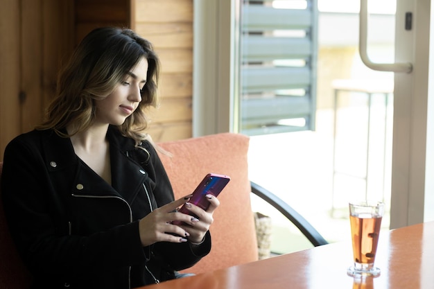 A close-up of a hotel loyalty program member reviewing their account on a mobile app, showing various point-earning options in light of Major Hotel Chains Announce Loyalty Program Changes: What the 15% Point Devaluation Means for You.
