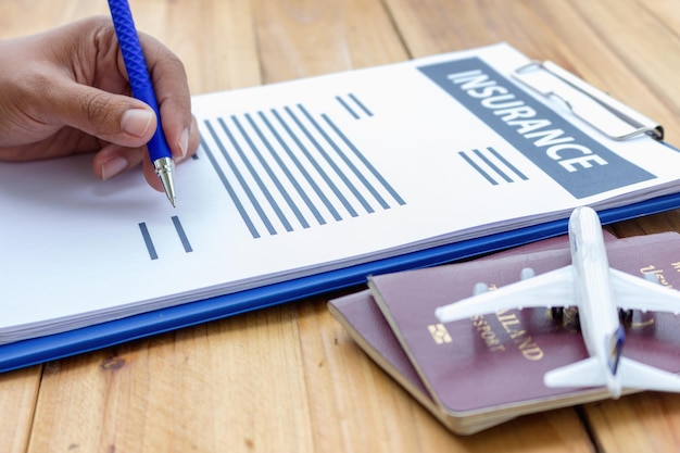 A close-up of a travel insurance policy document highlighting the section on trip cancellation coverage due to pandemic-related reasons. This signifies Travel Insurance Updates: Understanding the New Coverage Options for Pandemic-Related Disruptions.