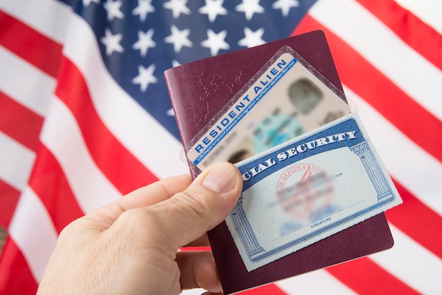 A close-up shot of a US visa in a passport, showing the applicant's photo and important visa details. The background is a blurred image of the US Capitol Building. The focus is on the visa itself, emphasizing the importance of understanding The Latest on US Visa Requirements: Updates for International Travelers Visiting in 2025.