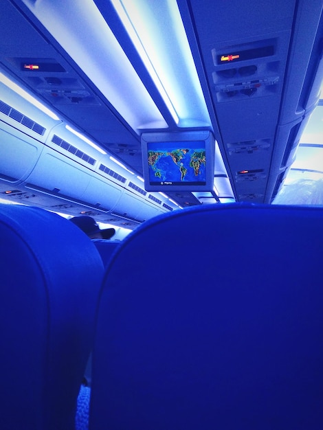 The interior of an airplane with accessible lavatories and wider aisles, highlighting the onboard enhancements under the New Accessibility Standards for Air Travel: What Passengers with Disabilities Need to Know. The scene is clean and modern, emphasizing comfort and accessibility.