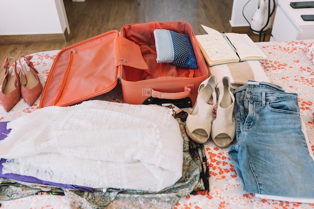 A suitcase neatly packed with clothing organized in packing cubes. Clear plastic bags contain liquids, and electronics are easily accessible at the top. This showcases efficient and compliant packing for airport security. The title Learn to Navigate Airport Security Like a Pro: Insider Tips and Tricks from Former TSA Agents is represented through the visual of a well-prepared traveler.