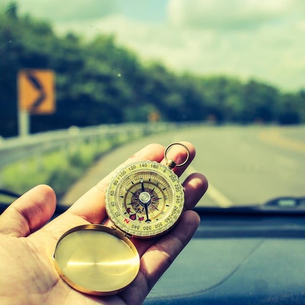 A person holding a compass at eye level, sighting a distant landmark. The compass needle is clearly visible, showing a bearing being taken against the backdrop of a mountain range, illustrating precision and focus in advanced map reading and navigation. The importance of advanced map reading and navigation skills: Never Get Lost Again with Our Expert Training is highlighted here.